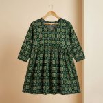 Emerald green cotton kurti with floral print, front view — Aaveno